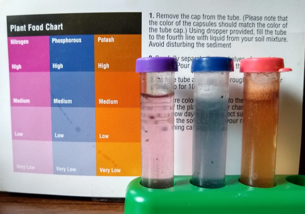 Results for a test for nutrients, such as nitrogen, phosphorous, and potash. Colors in test tubes correspond to swatches on a chart. All nutrients are pale in color so low or very low.